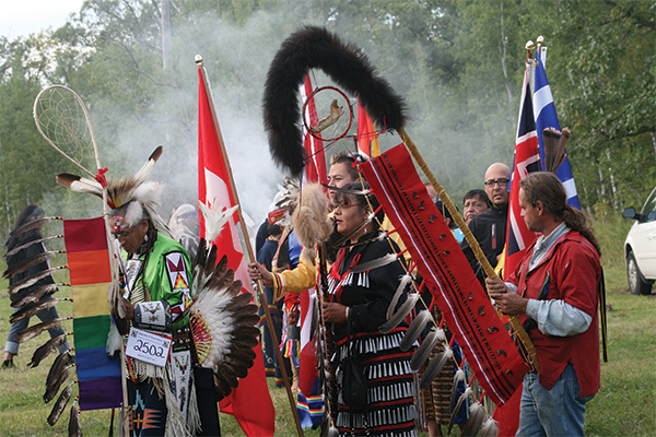 Group of indigenous people involved in a Pow Wow.